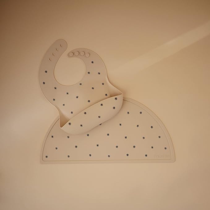 mushie Silicone Baby Bib | Adjustable Fit Waterproof Bibs (Black Daisy)