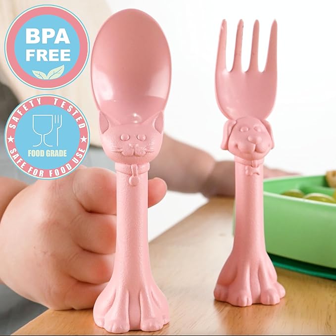 Made in USA Spoon la la Toddler Utensils Set (2 Pack) & Board Book - Spoon & Fork for Kids, Self-Standing 3D Ergonomic Cat & Dog Handles, BPA-free, Dishwasher Safe Baby Silverware (Pink)