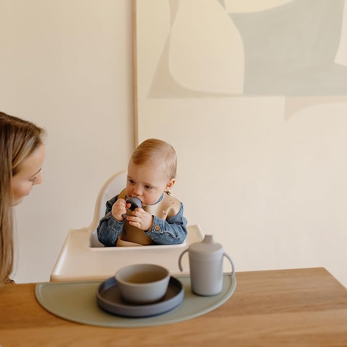 mushie Silicone Baby Bib | Adjustable Fit Waterproof Bibs (Rocket Ship)