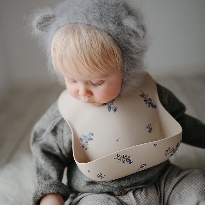 mushie Silicone Baby Bib | Adjustable Fit Waterproof Bibs (Lilac Flowers)